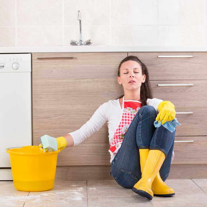 Woman scrubbing Tile floors