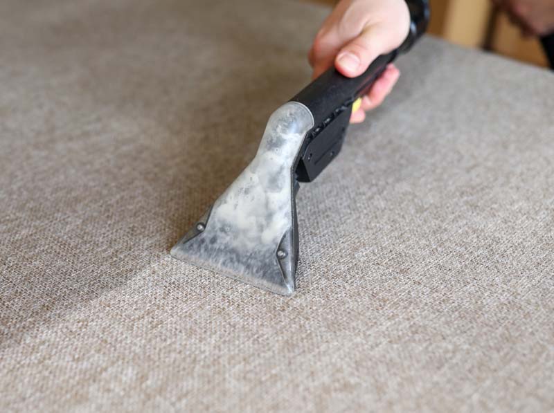 Upholstery Wand cleaning a couch